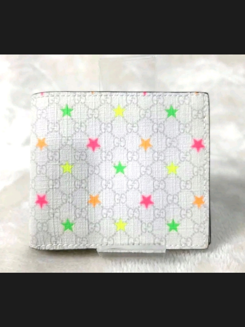 Gucci White Micro GG Supreme Canvas Neon Stars Bifold Wallet featuring a vibrant
